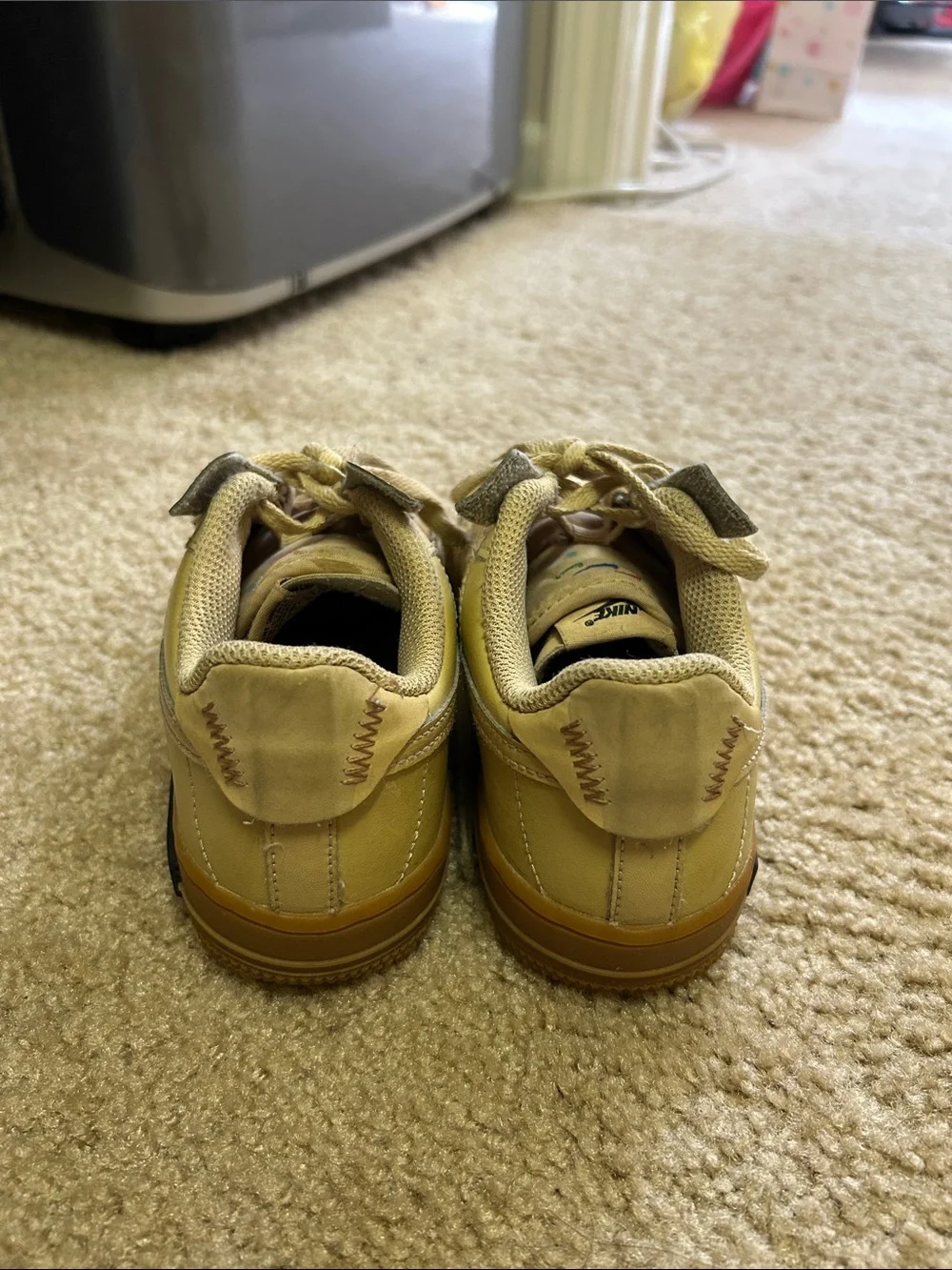 Nike Kids beige/tan sneakers.